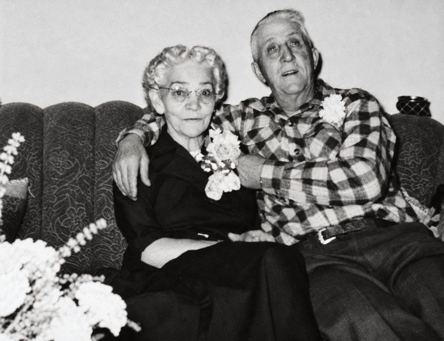 Dora and Albert Beus seated together at their fiftieth wedding anniversary